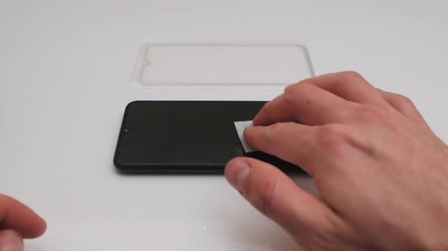 Preparing to Replace the Protective Glass on a Smartphone Degreasing Screen