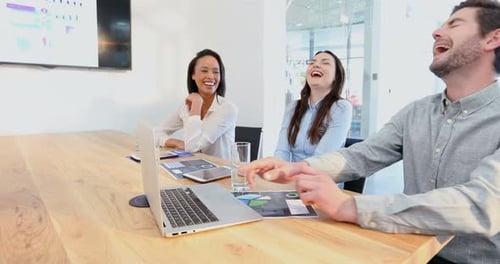 Cheerful Colleagues Working Together in a Modern Office