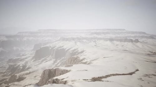 Snowcovered Rocks on a Windy Plateau