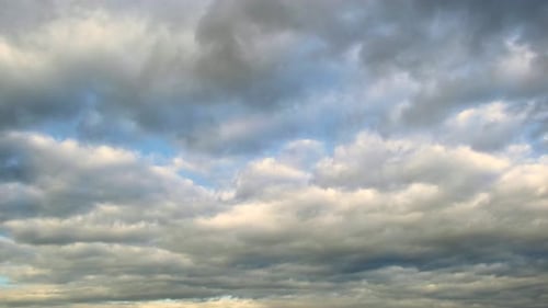 Clouds Moving Across a Blue Sky