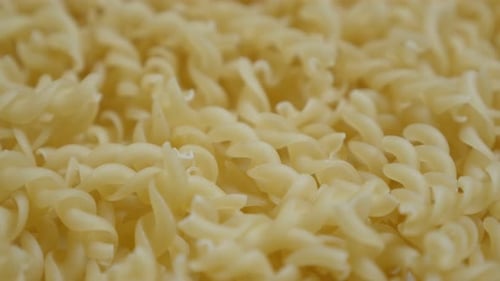 Famous Italian food background close-up 4K 2160p 30fps UltraHD tilting footage - Corkscrew shaped pa