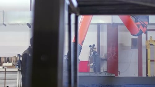 Industrial Welder at Work in Factory Workshop