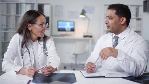 Doctors Collaborate in Brightly Lit Office Space