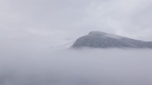 Flying Over the Clouds in the Mountains