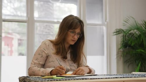 Millennial female professional working in a creative office