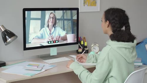 African Teen School Girl Distance Learning During Online Class with Teacher