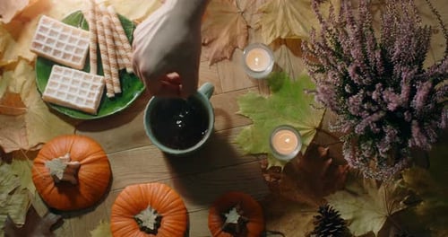 Inviting Fall Scene with Tea and Autumnal Decor