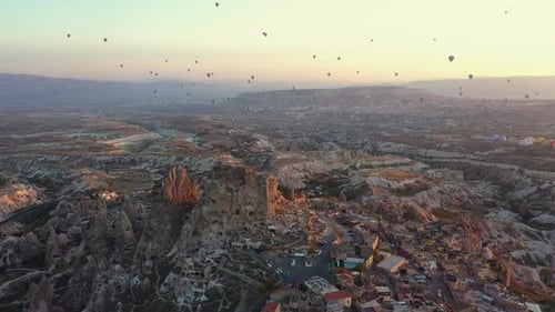 Aerial View of Hot Air Balloons Over Rural Landscape