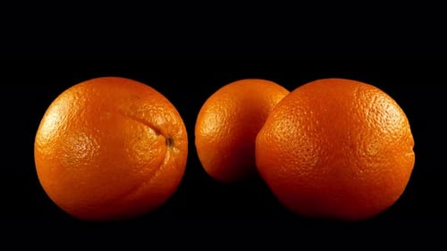 Oranges Rotating on a Black Background