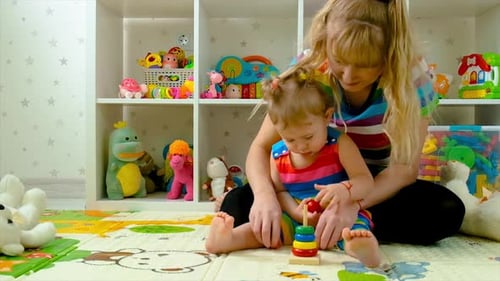 Mother and Child Play with Stacking Rings