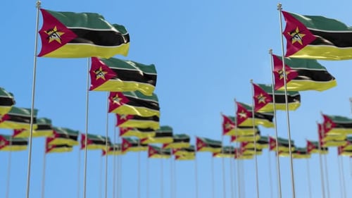 Mozambique Flags Waving in Blue Sky