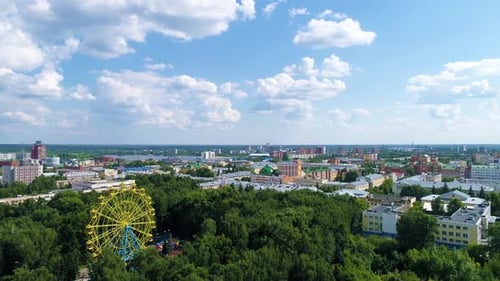 Town square in the park in summer cloudly day - Drone Footage
