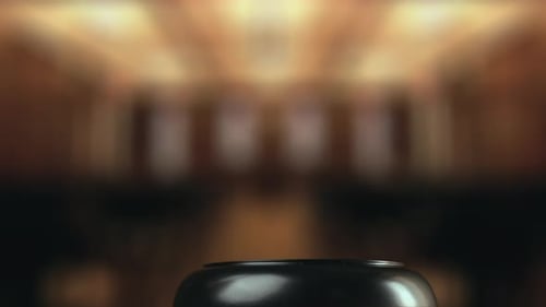 Judge is Hitting Gavel Off a Block in Courtroom