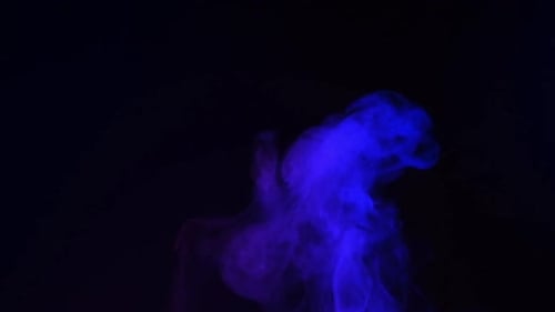 Blue and Purple Wispy Smoke on Black Background