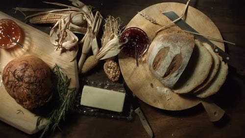 Rustic Food Arrangement with Bread, Butter, and Jam