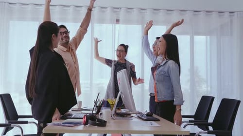 Successful Business People Celebrating Project Success at Office