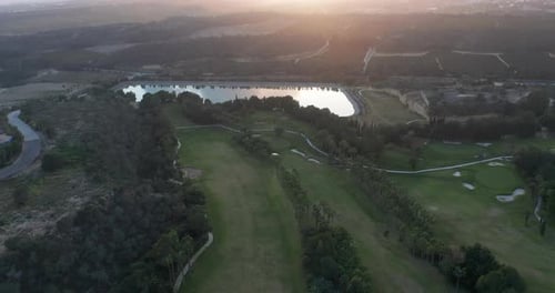 Aerial View. Golf Course with Green Field in the Valley. Green Turf Scenery.