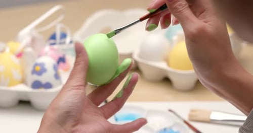 Painting on egg for Easter holiday