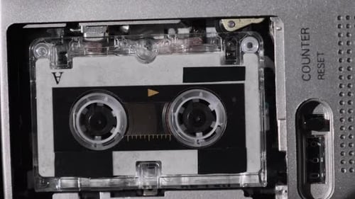 The Microcassette Spins in a Portable Handheld Recorder Tape Retro Player