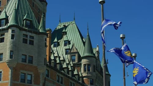 Historical Building with Waving Flags on Clear Day