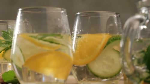 Refreshing Citrus Cucumber Water in Clear Glasses