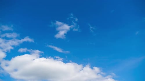 Fluffy White Clouds in a Bright Blue Sky