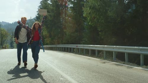 Couple Walk Forest Highway in Mountains