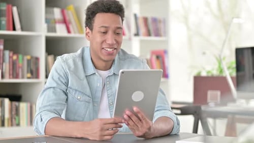 Young Adult Using Tablet for Online Video Call