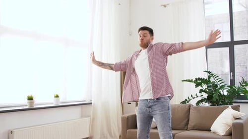 Happy Young Man Dancing at Home 65