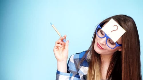 Woman with Question Mark and Pen Thinking