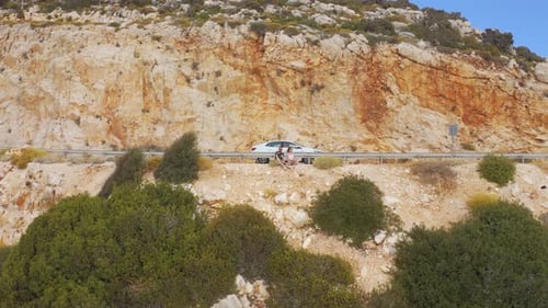 Young Couple Tourists Sit on the Shores of the Mediterranean Sea on the Road From Demre To Antalya