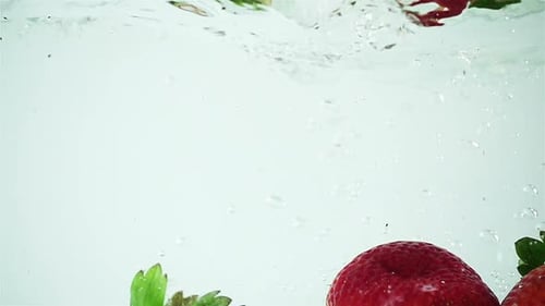 Strawberries Splashing in Water