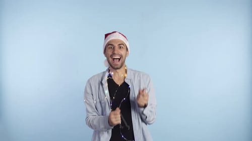 Man Celebrating Christmas with Sparklers and Lights