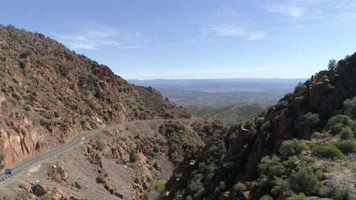 Aerial shot of a road through hills