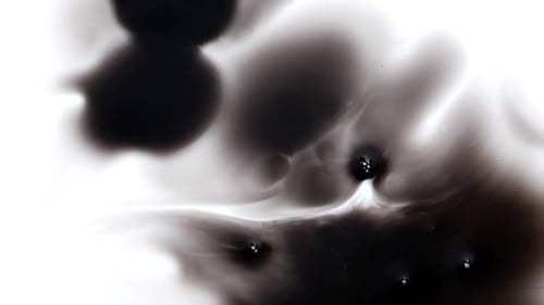 Black Ink Spreading on White Surface - Abstract Texture