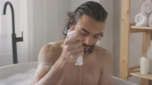 Man Washing Hair in Bubble Bath