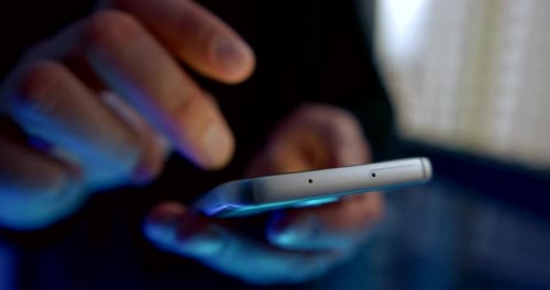 Male User Is Swiping By Display of Smartphone, Closeup