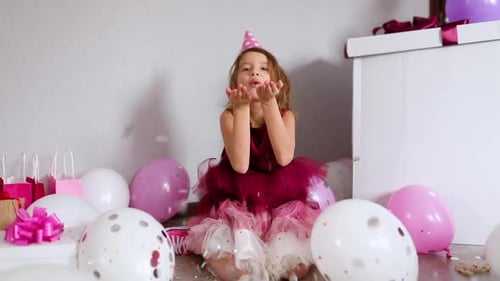 Girl Celebrates Birthday with Confetti and Balloons