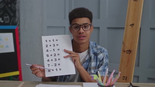 Teen Giving Arithmetic Lesson at Home