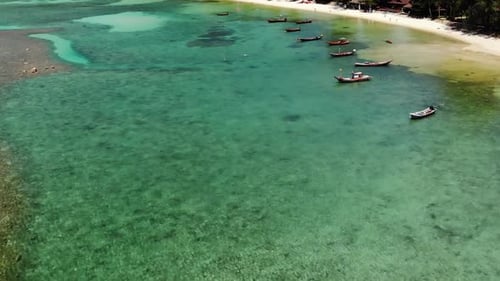 Boats Near Shore of Island. Traditional Colorful Fishing Vessels Floating on Calm Blue Water Near