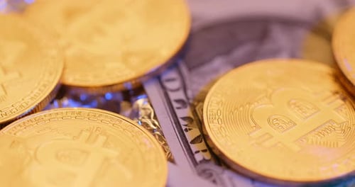 Golden Bitcoin Coins and US Dollar Currency