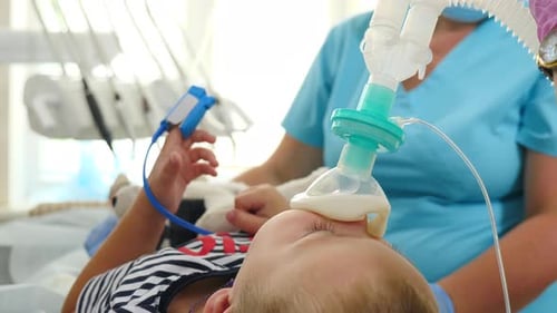 Child Receiving Oxygen in a Hospital Room