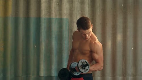 Man Lifting Weights to Build Muscle