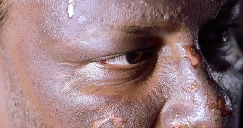 Man's Intense, Sweaty Face Close Up