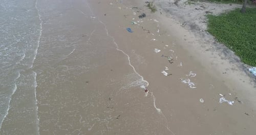 Trash, plastic, garbage, bottle... environmental pollution on the beach
