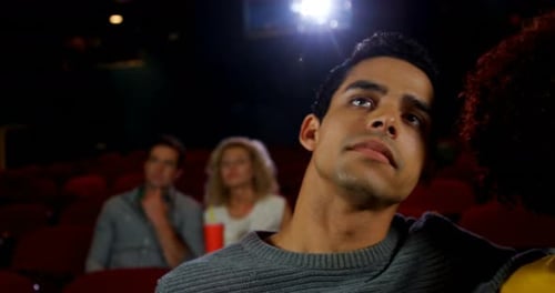 Couple watching movie in theater 4k