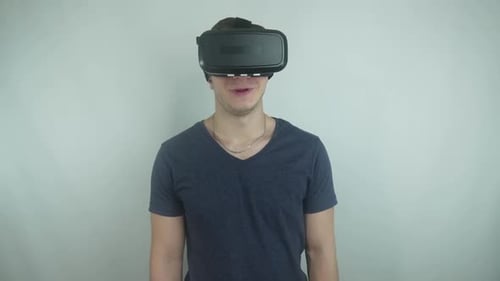 Young Man Wearing Virtual Reality Headset Indoors