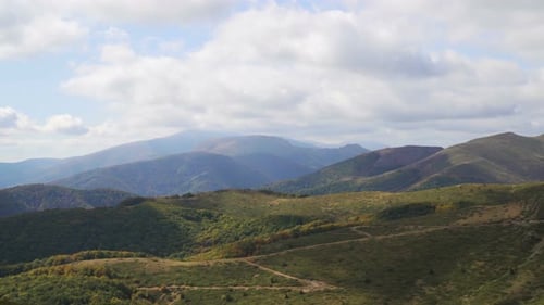 Scenic Panoramic View of Idyllic Rolling Hills, Summer Landscape with Lush Green Mountain Pastures