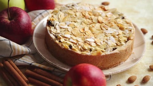 Freshly Baked Homemade Apple Pie with Almond Flakes Cake on Yellow