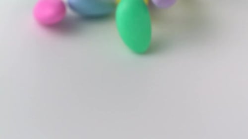 Colorful Pastel Candies Falling in Slow Motion